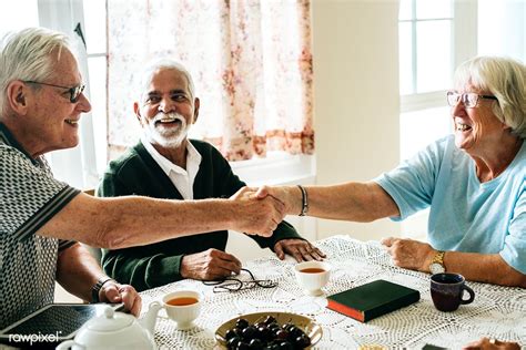 Casual Seniors Shaking Hands Premium Image By Emerson