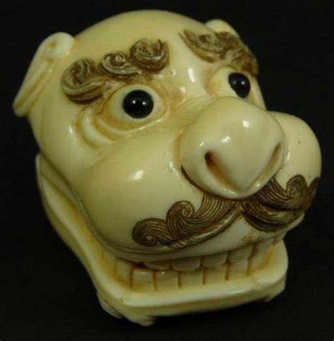 Carved Ivory Hidden Scene Foo Dog Head Netsuke