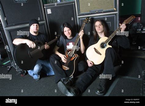 Soil Band Members Are Shown Posing With Their Acoustic Guitars And