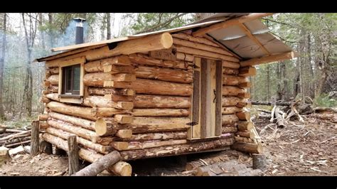 Tiny Off Grid Huntertrapper Log Cabin Working On The Logs Youtube