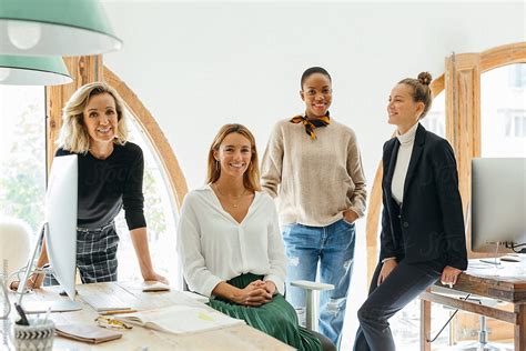 Female Teamwork Portrait At Office By Stocksy Contributor
