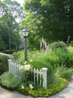 Stringing garland and lights on our lamp post! Cottage Garden Entry