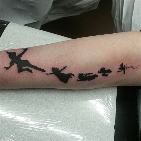 31 Peter Pan And Wendy Fly Away In This Forearm Tattoo Photo Credit