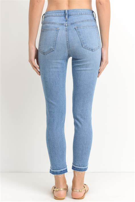 skinny released step frayed hem jeans at the maria vincent boutique maria vincent boutique