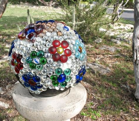 Garden balls tutorial showing how to make garden art balls with bowling balls or lamp globes and flat marbles. the flowerweaver: Color Carnival: Bowling Ball Art Garden