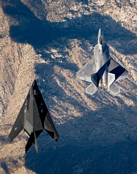 The F 22 Raptor And The F 117 Nighthawk Flying Side By Side
