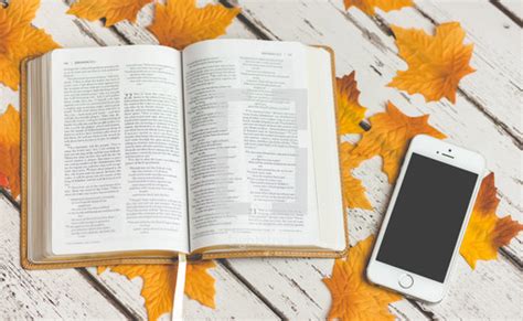 Open Bible On Fall Leaves And Iphone — Photo — Lightstock