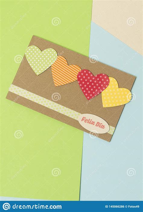 Permiso de trabajo y residencia para extranjeros en estados unidos. Paper Card With Hearts With Happy Day Spanish Phrase And Blue And Yellow Green Colors Stock ...