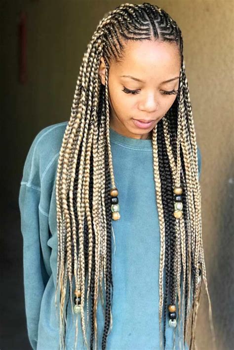 The braids have been decorated with wooden beads and a gold accessory. Fulani Braids With Loose Cascading Plaits #fulanibraids # ...