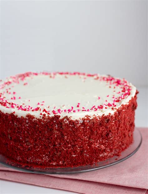 I looked at the ingredients and found a small amount of cocoa, vinegar, buttermilk, and food coloring. Red Velvet Cake with White Chocolate Frosting - Cookie ...