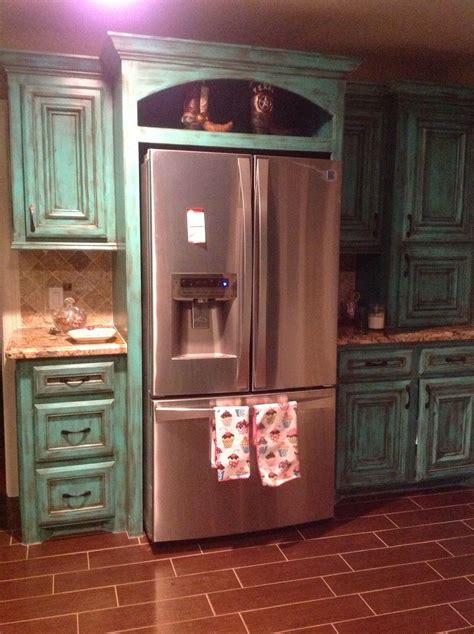 Adds a splash of disressed teal. All about rustic kitchen (cabinets, kits, furniture ...