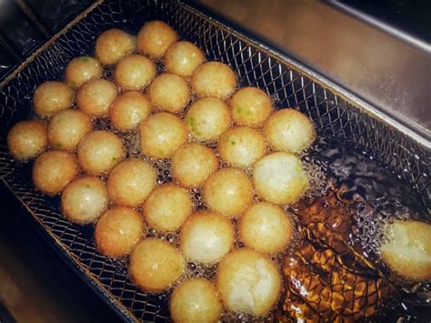 Frying Fish Balls With Oil In A Commercial Deep Fryer Stock Image