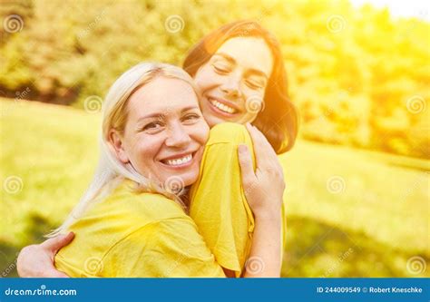 Two Happy Young Women Hug Each Other In Summer Stock Image Image Of