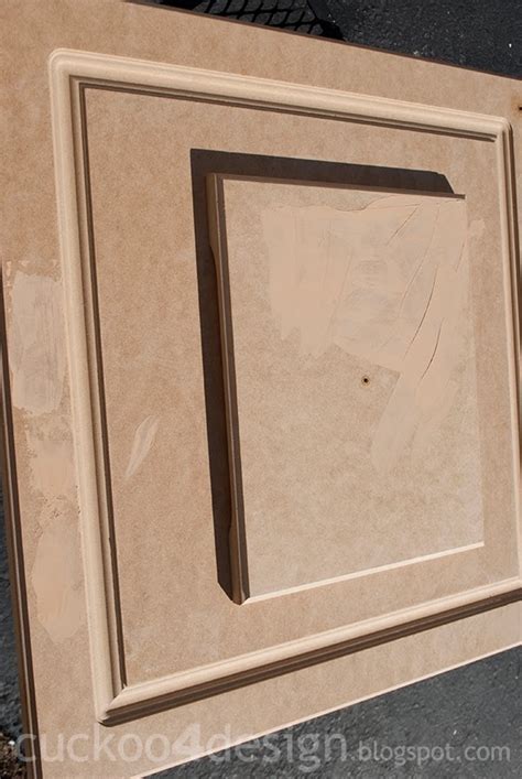 I was wondering if i peel the skin off the doors that are peeling down to the… is there a chance you can reattach the loose laminate instead of removing it? Painting Laminate Kitchen Cabinets - Cuckoo4Design