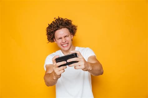 Premium Photo Happy Gamer Man In Casual T Shirt Playing Online Video