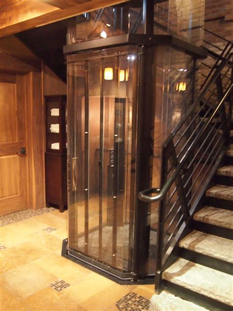 Custom Home Elevator In A Beautiful Rustic Home House Elevation