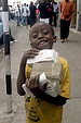 A boy carrying huge amounts of cash during Zimbabwe’s hyperinflation