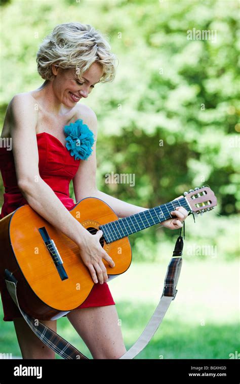 Woman Playing Guitar Stock Photo Alamy
