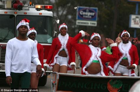 Gay African American Dance Team Marches In Christmas Parade Wearing Revealing Santa Claus