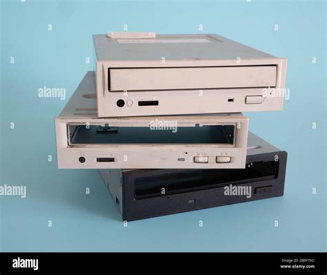 Old Disassembled Computer Dvd Drive For Recycle On Blue Background