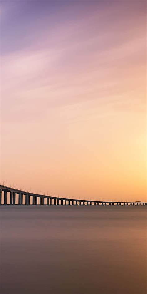 Download 1080x2160 Wallpaper Sunset Minimal Vasco Da Gama Bridge Sea