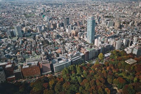 Beautiful View Of Downtown Tokyo With Skyscrapers And Green Park