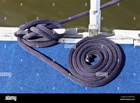 Boat Tied Up At A Dock With Mooring Rope On Bollard Stock Photo Alamy