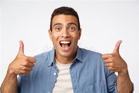 Enthusiastic Good Looking Young Happy Guy Showing Thumbs Up Encourage