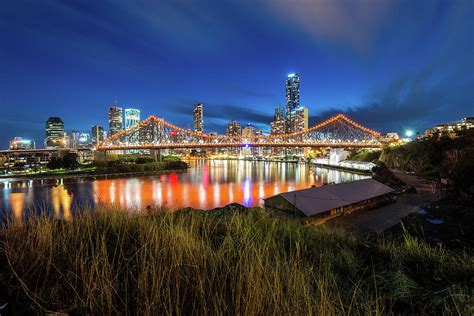 Story Bridge And Brisbane City During By Naphakm