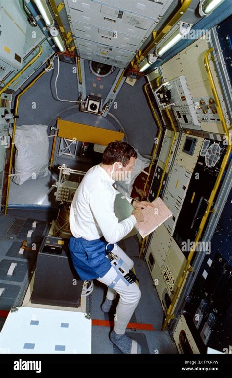 Nasa Astronaut David Hilmers Looks Over A Checklist In The Science