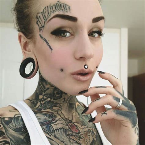 Cheek Piercings And Large Gauge Medusa Piercing Girl Rib Tattoos Small