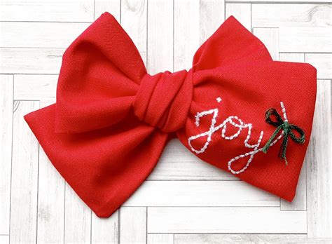 Use 3/8 or 5/8 inch ribbon to make a 2.50 inch surround a bow. Embroidered JOY Hand Tied Fabric Bow - Sparkles by Camila | Fabric bows, Homemade bows, Unique ...