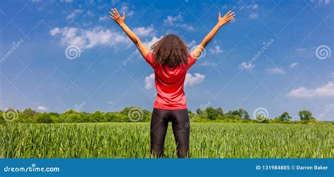 Female Woman Girl Runner Arms Raised In Green Field Panorama Stock