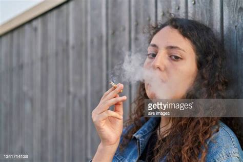 Woman Smoking Cigar Lounge Photos And Premium High Res Pictures Getty