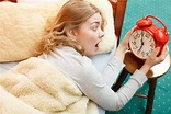 Woman Waking Up Late Turning Off Alarm Clock. Stock Photo - Image of ...