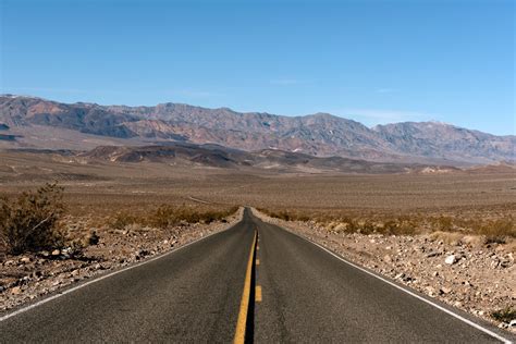 A Long Straight Road To The Horizon In Death Valley National Park