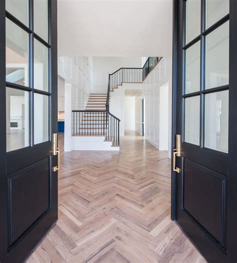 Beautiful Foyer With Herringbone Wood Floor Designed And Built By