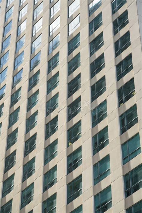Grid Multi Storey Building Close Up With Clear Reflective Glass Windows
