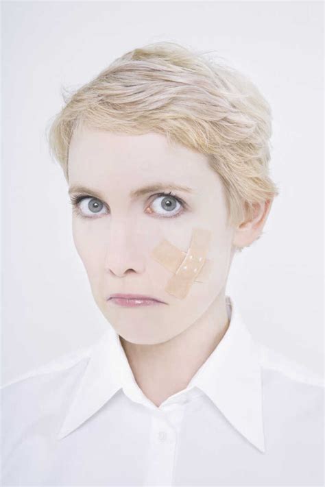 Woman With Band Aid On Cheek Stock Photo