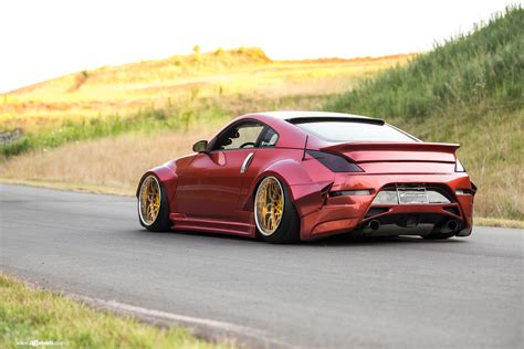 Widebody Red Nissan 350z Stanceda And Put On Gold Avant Garde Wheels