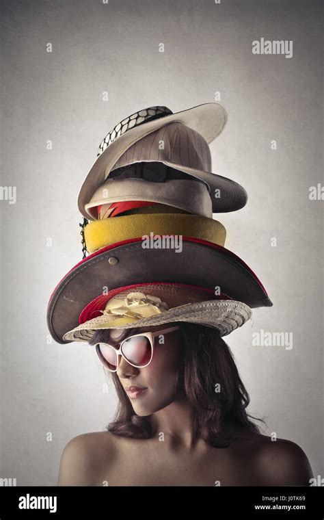 Woman Wearing Multiple Hats Stock Photo Alamy