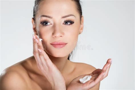 Beautiful Smiling Woman Applying Cream On Face Stock Photo Image Of