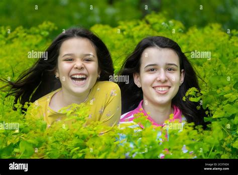 Portrait Of Two Smiling Sisters Stock Photo Alamy