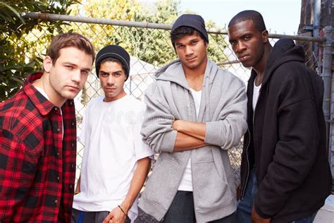 Group Of Young Men In Urban Setting Standing By Fe Stock Image Image