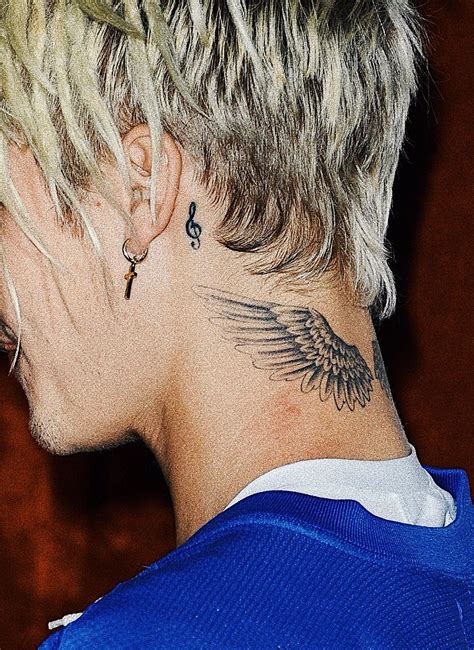 The Meaning Behind Justin Biebers Rose Tattoo On His Neck