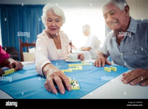Group Of Seniors Playing Dominoes Stock Photo Alamy