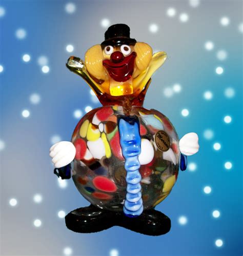 A murano glass clown, mid 20th century, the body with pulled 'spatter' colours encased in clear glass and with applied decorations and features in opaque and semi opaque colours. Murano Clown Authentic Vintage 1950s, made in Murano Italy ...