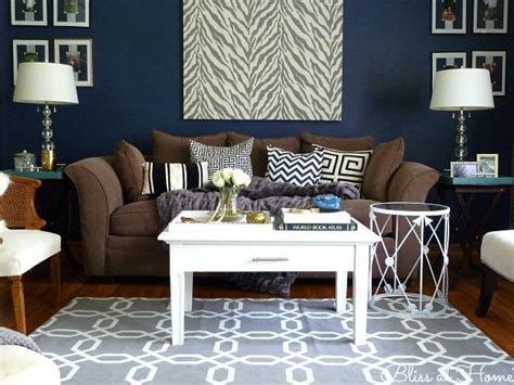 Both wood types are 100 plus year old barn wood which has been salvaged from structures that were part of minnesota's farming history. Love the rug! | Brown living room, Brown living room decor ...