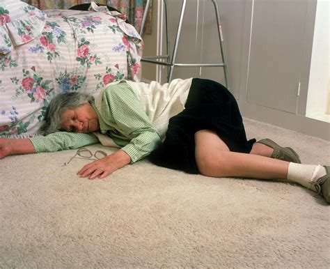Elderly Woman Lying On Floor After A Fall Photograph By Chris Priestscience Photo Library