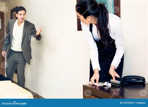 Room Maid Looking Through Hotel Guest`s Wallet Stock Image Image Of Hotel Black 91879309